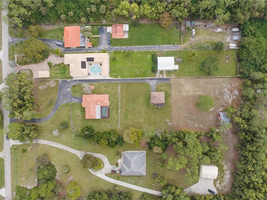 5960 Copper Leaf Lane Naples, FL 34116 - Photo 33 of 37 an aerial view of residential houses with outdoor space and swimming pool