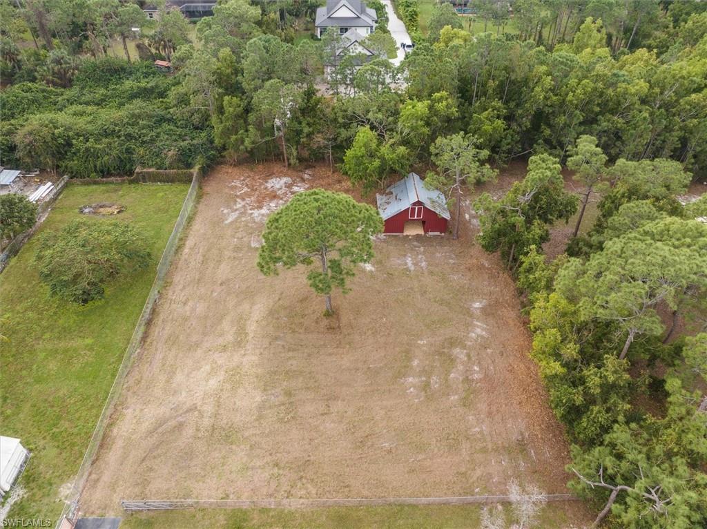 5960 Copper Leaf Lane Naples, FL 34116 - Photo 35 of 37 a view of a yard with an outdoor space
