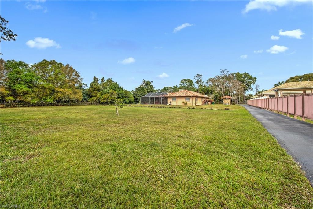 5960 Copper Leaf Lane Naples, FL 34116 - Photo 37 of 37 a view of a lake with houses
