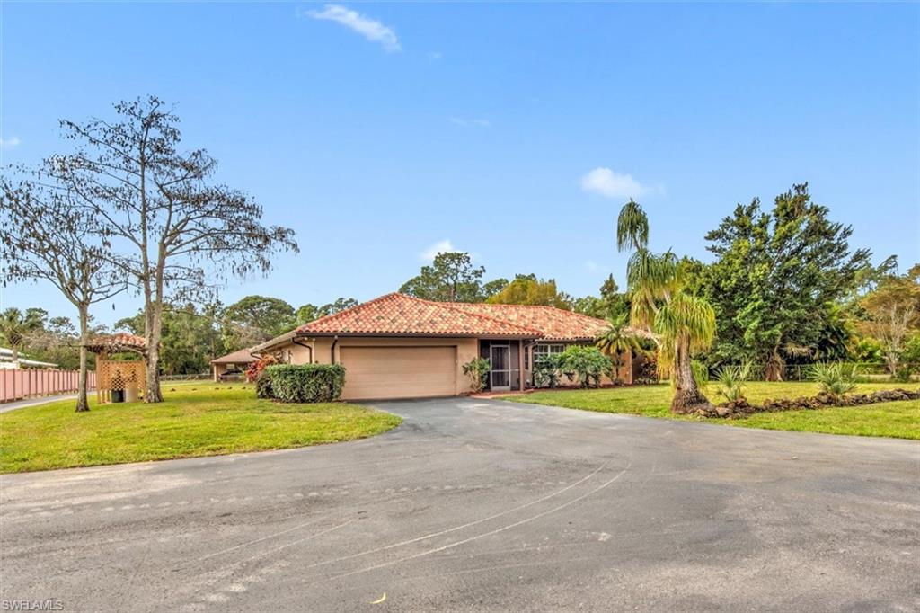 5960 Copper Leaf Lane Naples, FL 34116 - Photo 4 of 37 a view of a house with basketball court