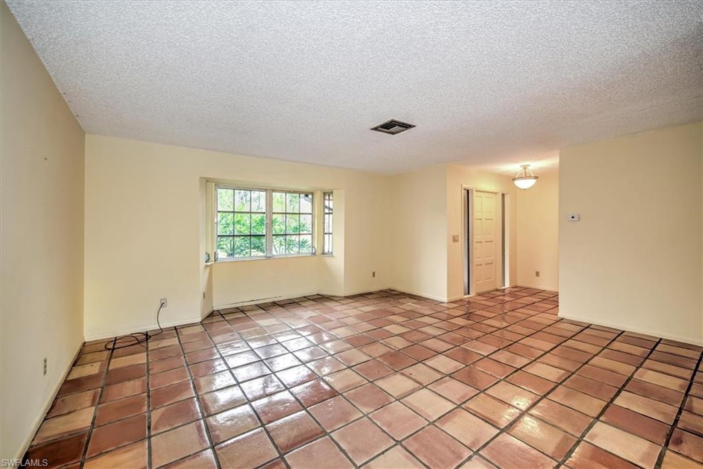 5960 Copper Leaf Lane Naples, FL 34116 - Photo 6 of 37 a view of an empty room and window