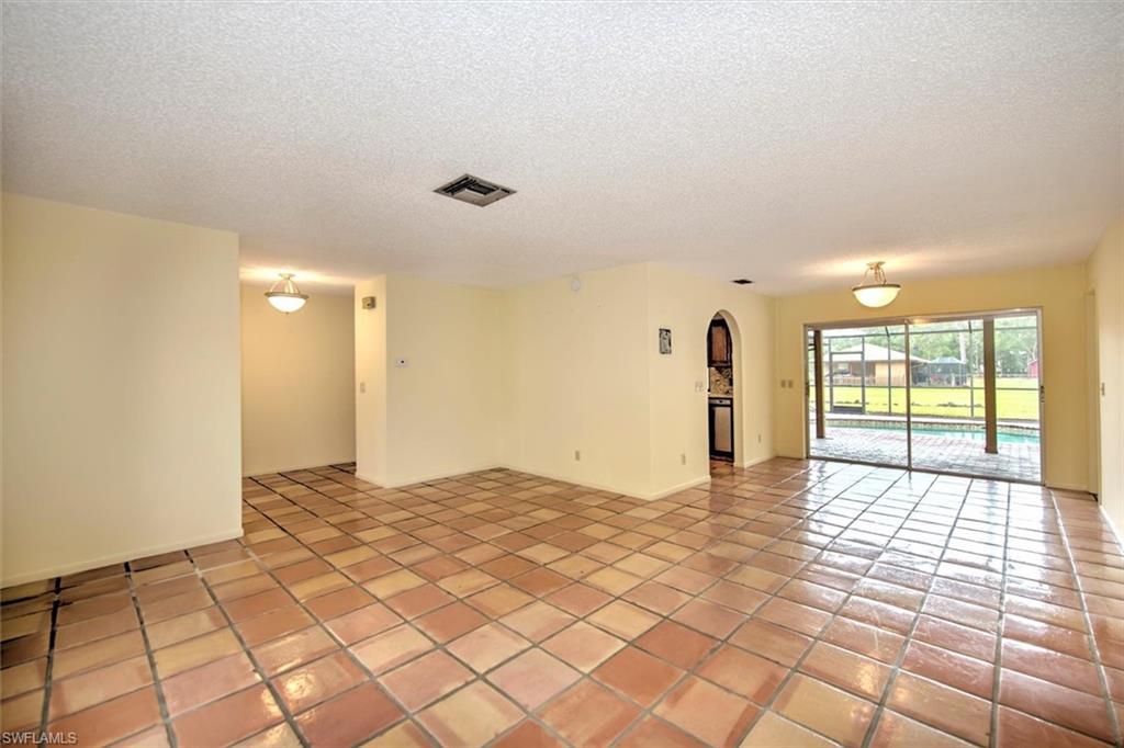 5960 Copper Leaf Lane Naples, FL 34116 - Photo 7 of 37 a view of an empty room and window