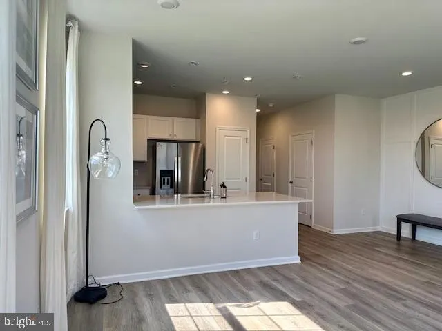 a view of a living room with a large window
