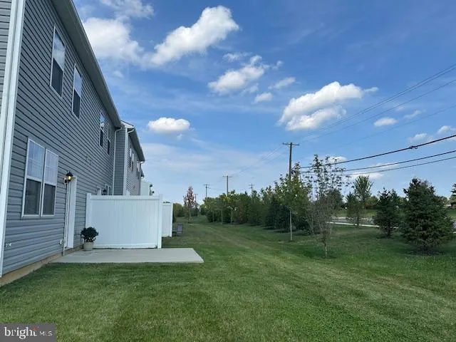 a view of house with backyard
