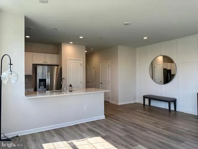 a view of kitchen with stainless steel appliances kitchen island