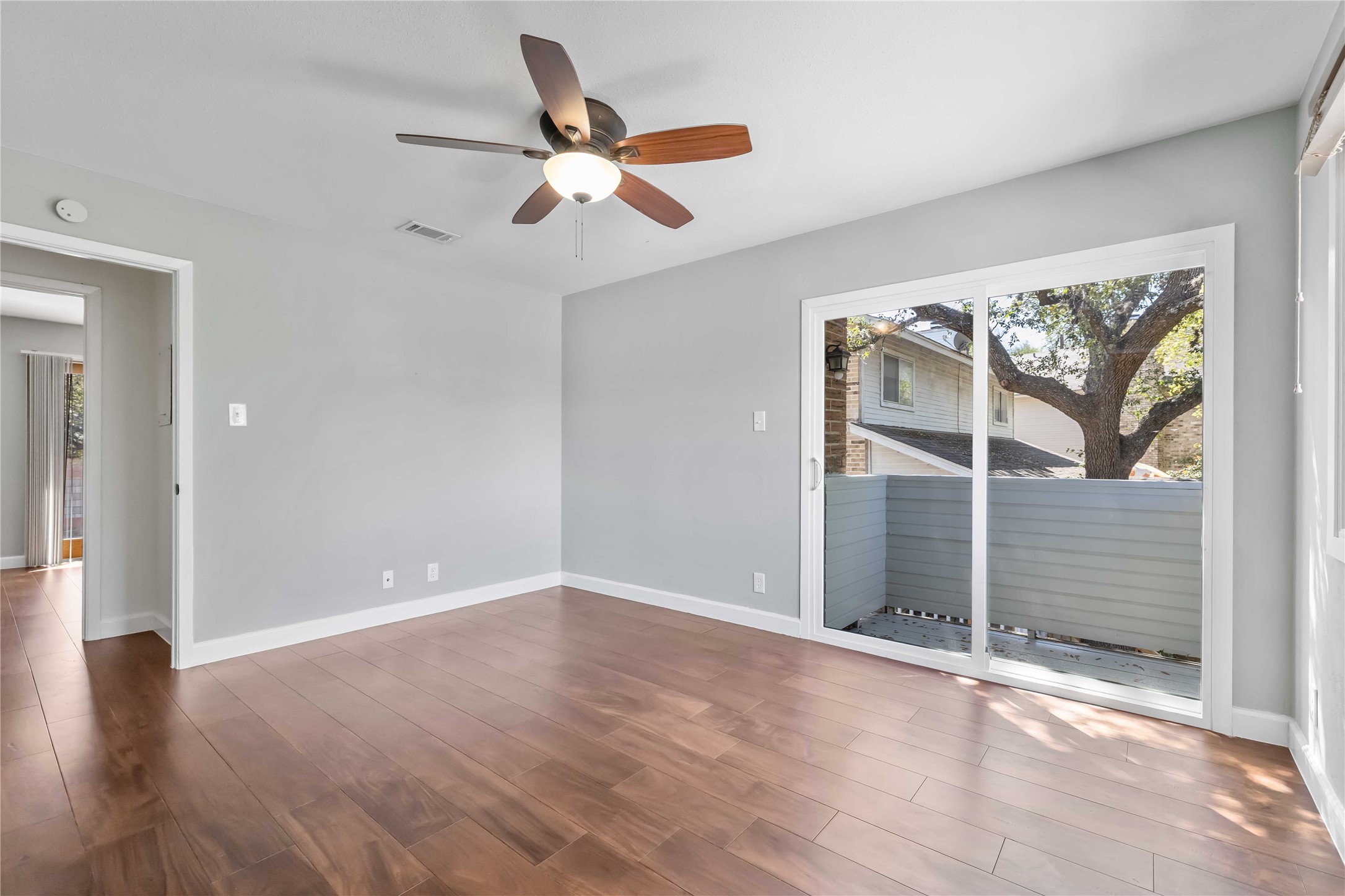 1703 Waterloo Trail, Unit B Austin, TX 78704 - Photo 18 of 36 Spare room featuring ceiling fan and dark wood-style floors