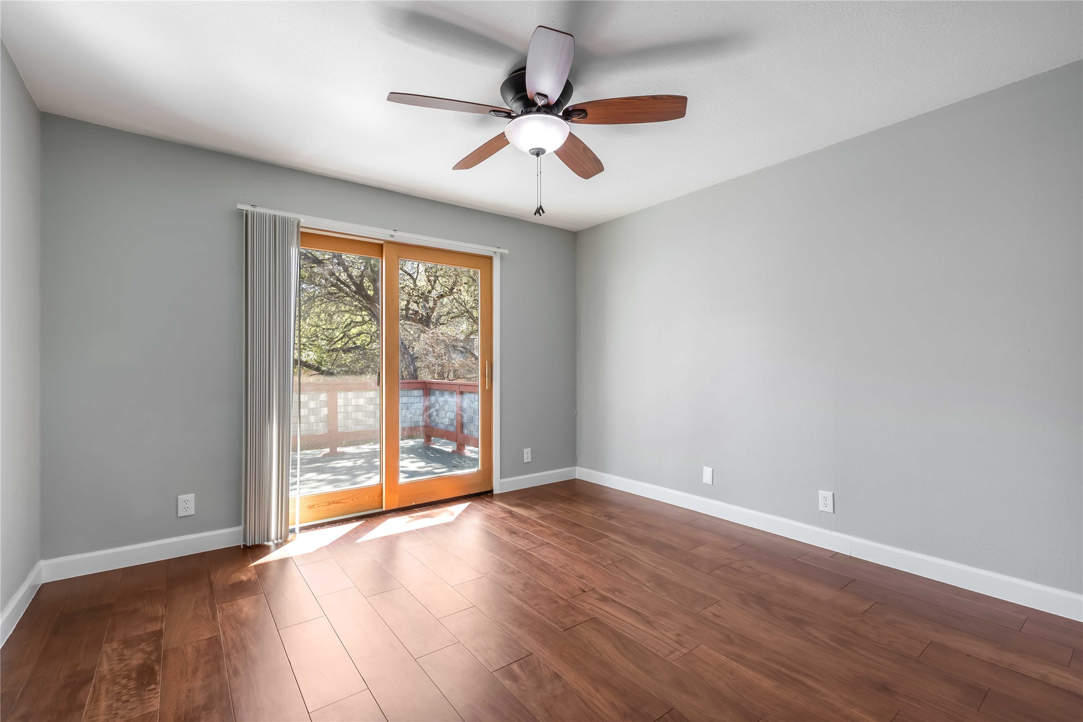 1703 Waterloo Trail, Unit B Austin, TX 78704 - Photo 22 of 36 Empty room with dark wood-style floors and a ceiling fan