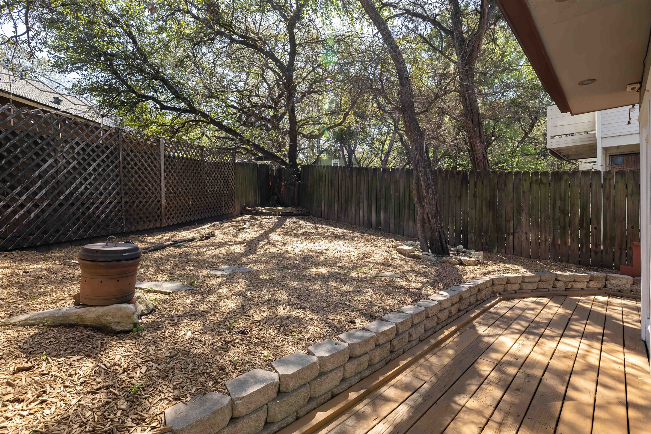 1703 Waterloo Trail, Unit B Austin, TX 78704 - Photo 27 of 36 Fenced backyard with a deck
