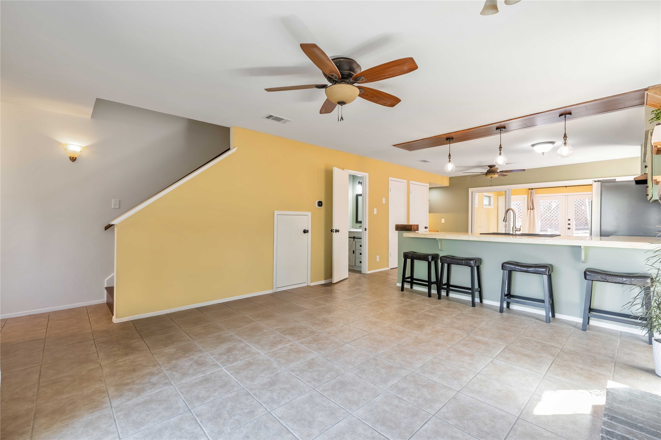 1703 Waterloo Trail, Unit B Austin, TX 78704 - Photo 9 of 36 Living room with a ceiling fan and light tile patterned flooring