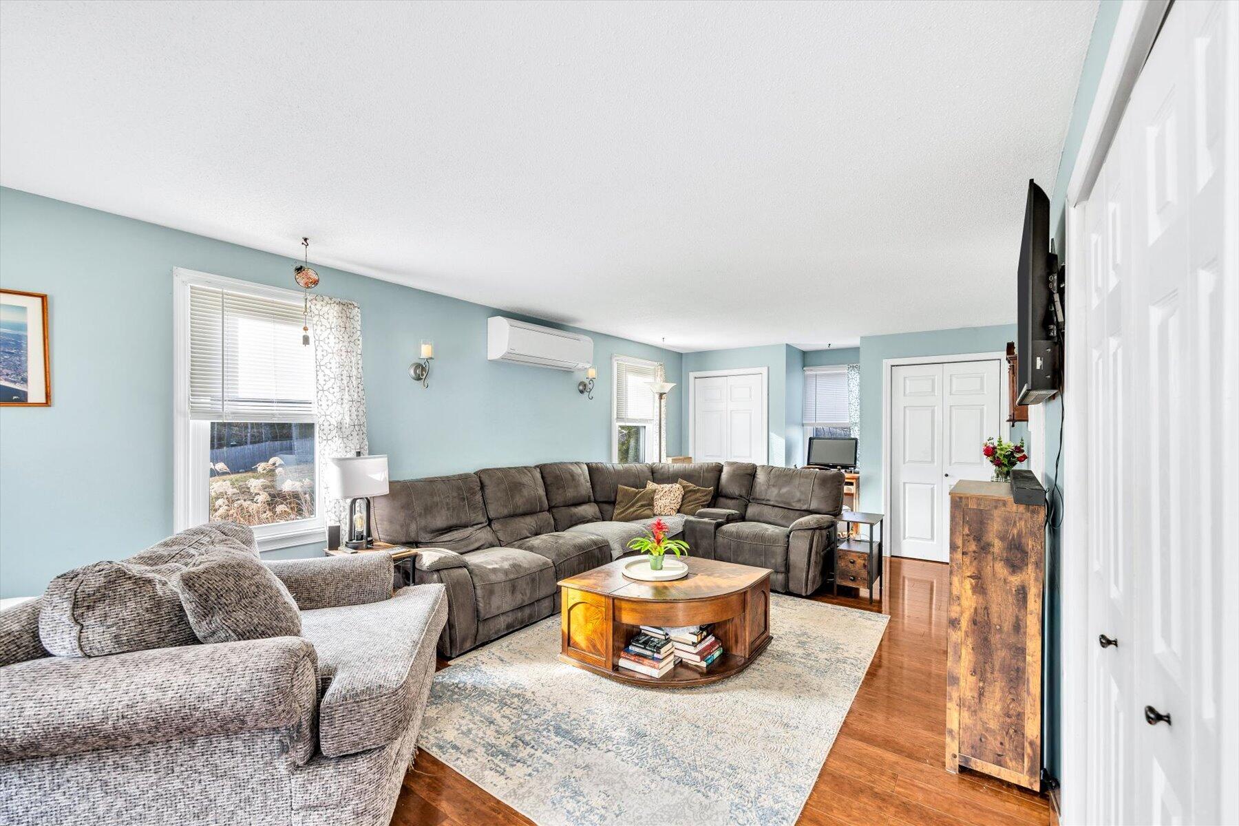 39 Papnomett Road Mashpee, MA 02649 - Photo 12 of 34 a living room with furniture and a large window