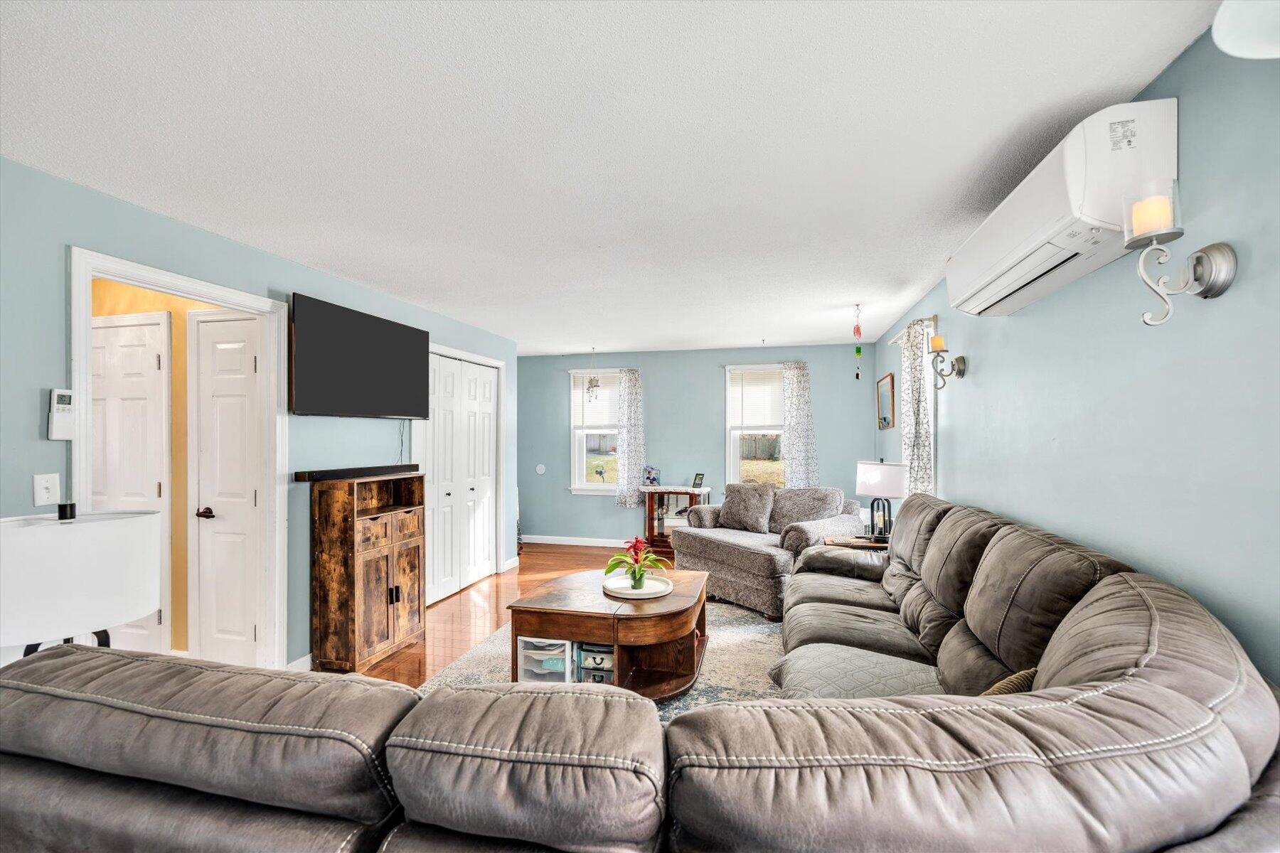 39 Papnomett Road Mashpee, MA 02649 - Photo 13 of 34 a living room with furniture fireplace and a flat screen tv