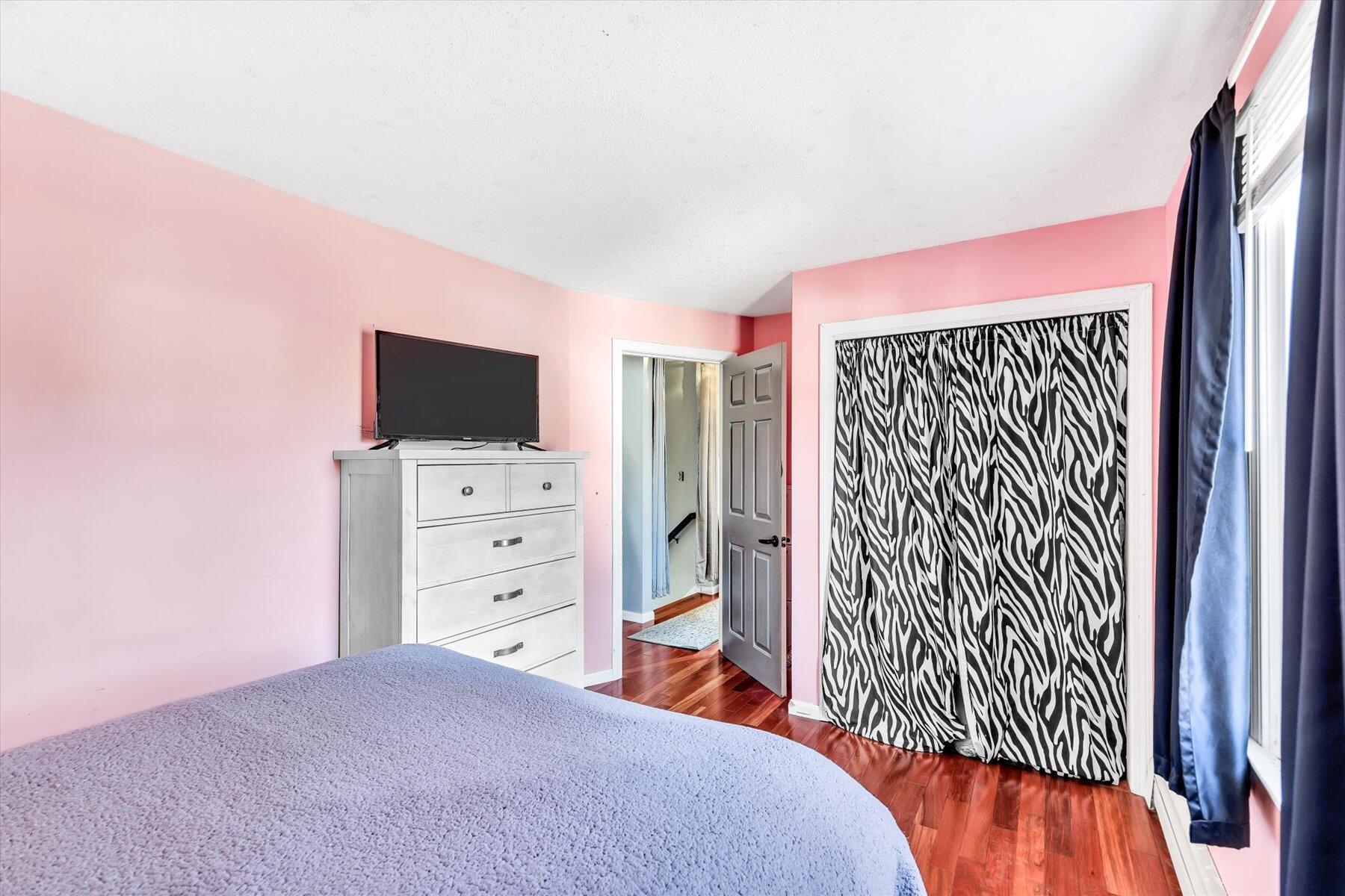 39 Papnomett Road Mashpee, MA 02649 - Photo 19 of 34 a bedroom with a bed and a flat screen tv