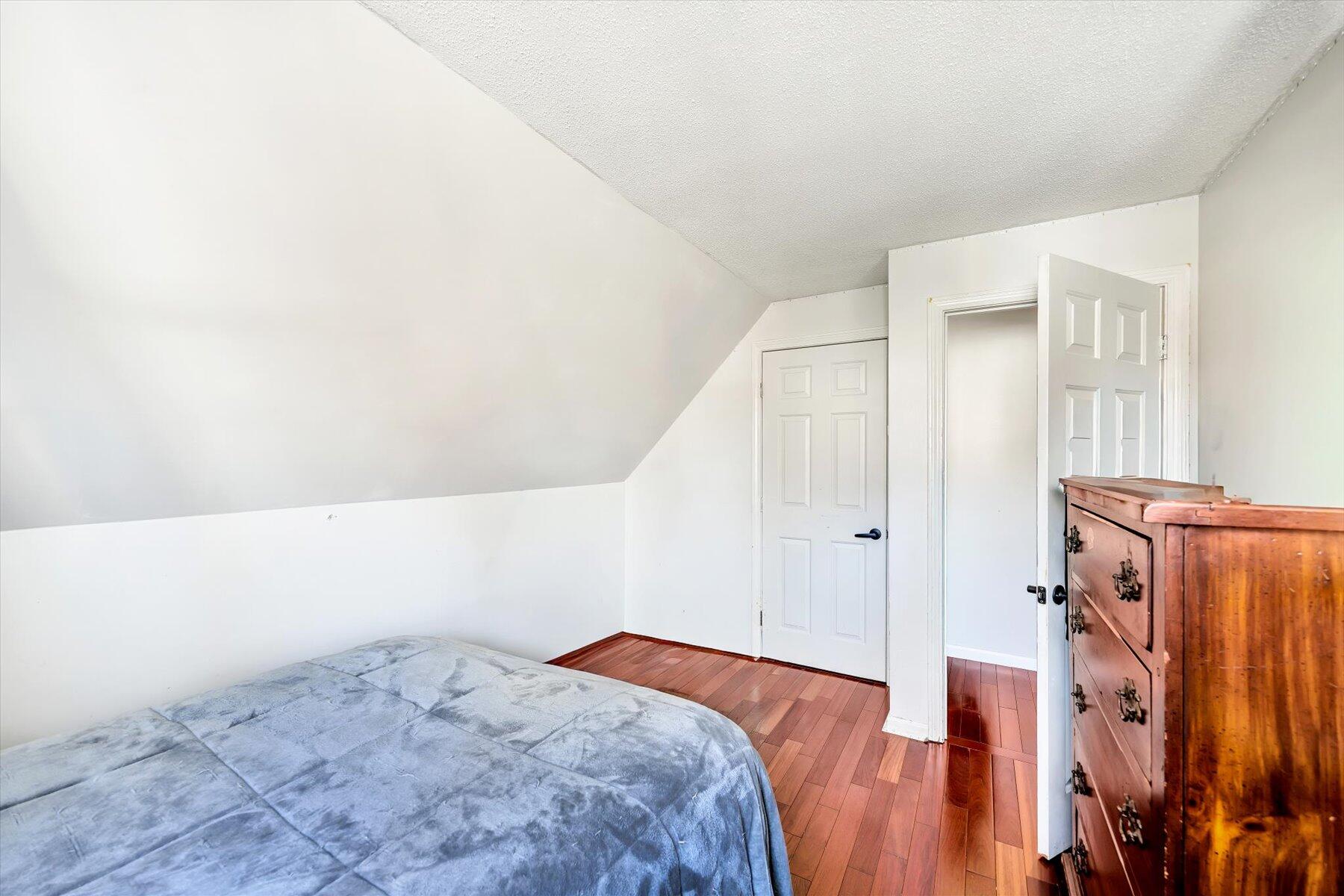 39 Papnomett Road Mashpee, MA 02649 - Photo 21 of 34 a bed room with a bed and a closet