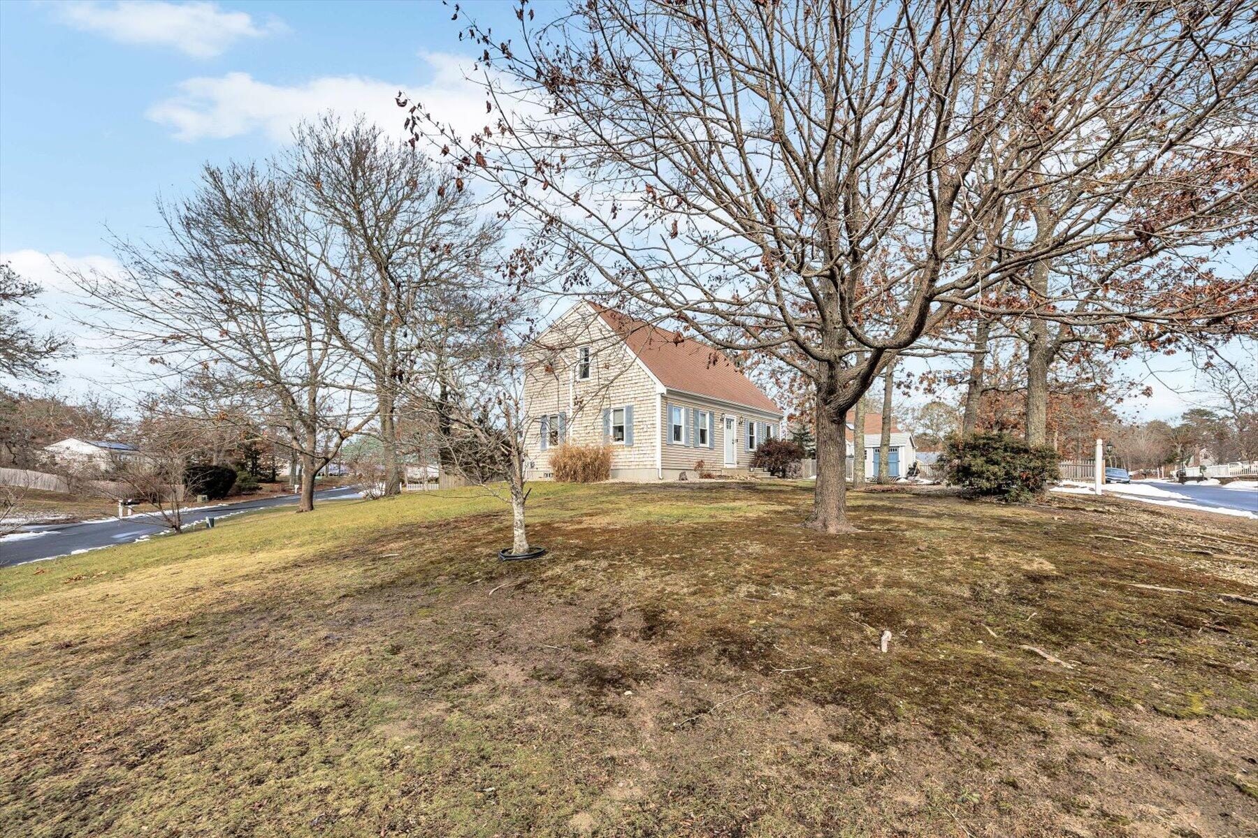 39 Papnomett Road Mashpee, MA 02649 - Photo 31 of 34 a view of a yard with a house
