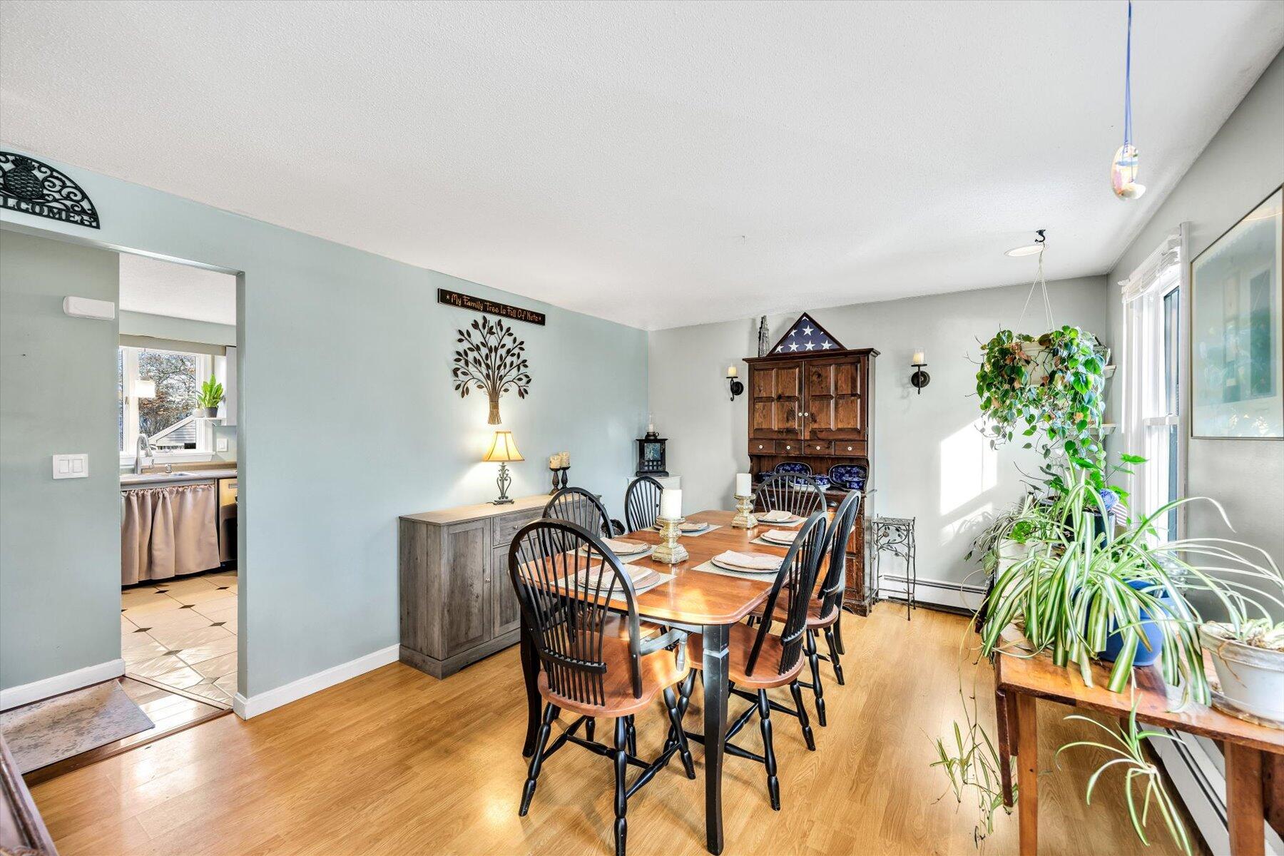 39 Papnomett Road Mashpee, MA 02649 - Photo 4 of 34 a view of a dining room with furniture and wooden floor
