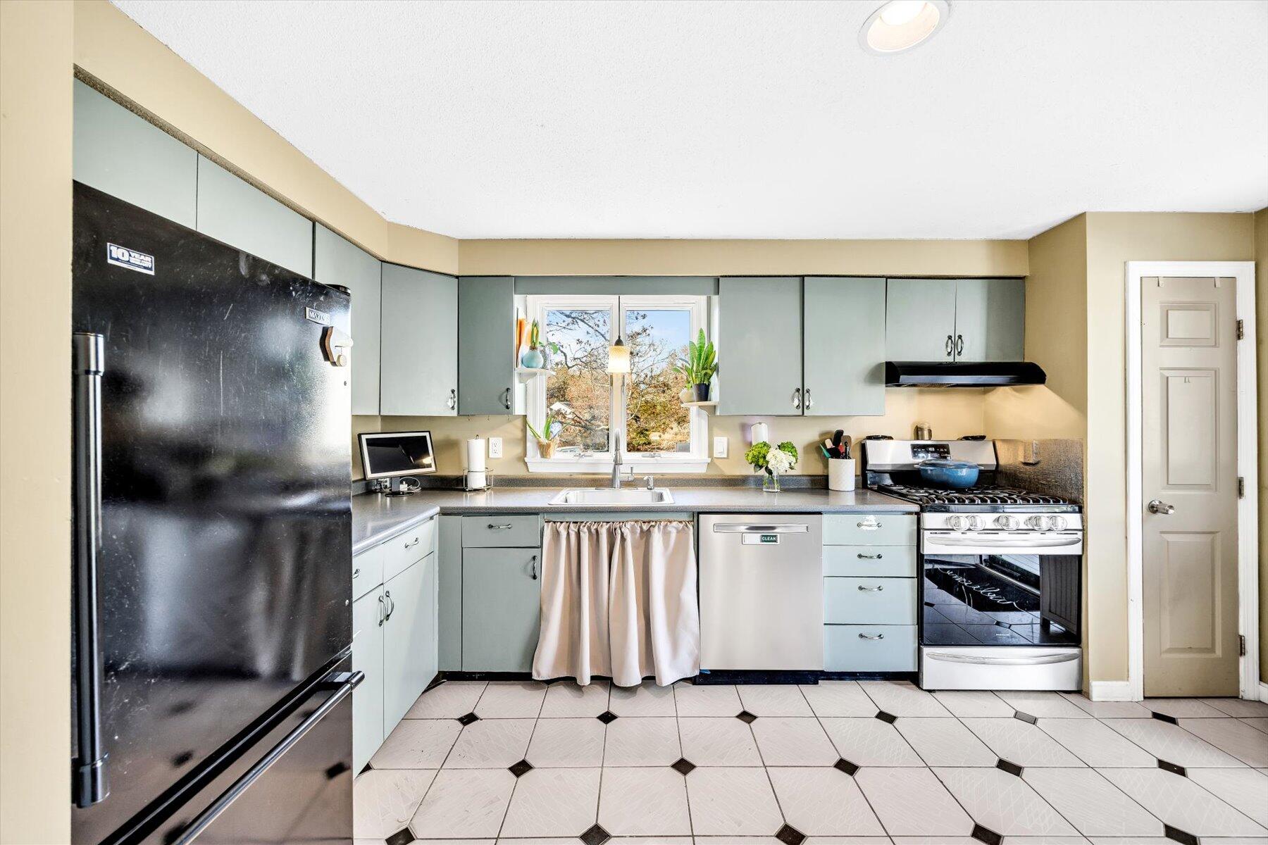 39 Papnomett Road Mashpee, MA 02649 - Photo 5 of 34 a kitchen with stainless steel appliances a refrigerator sink and cabinets