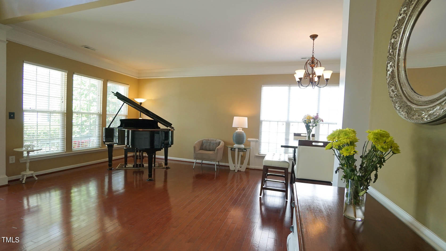 3318 Colorcott Street Raleigh, NC 27614 - Photo 15 of 28 a view of a dining room with furniture window and wooden floor