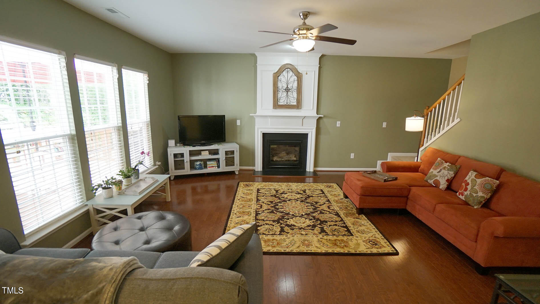 3318 Colorcott Street Raleigh, NC 27614 - Photo 16 of 28 a living room with furniture fireplace and flat screen tv