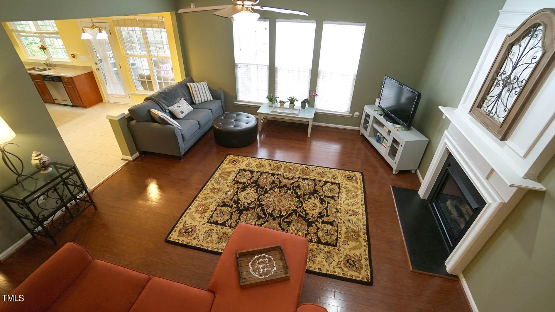 3318 Colorcott Street Raleigh, NC 27614 - Photo 18 of 28 a living room with furniture and a fireplace
