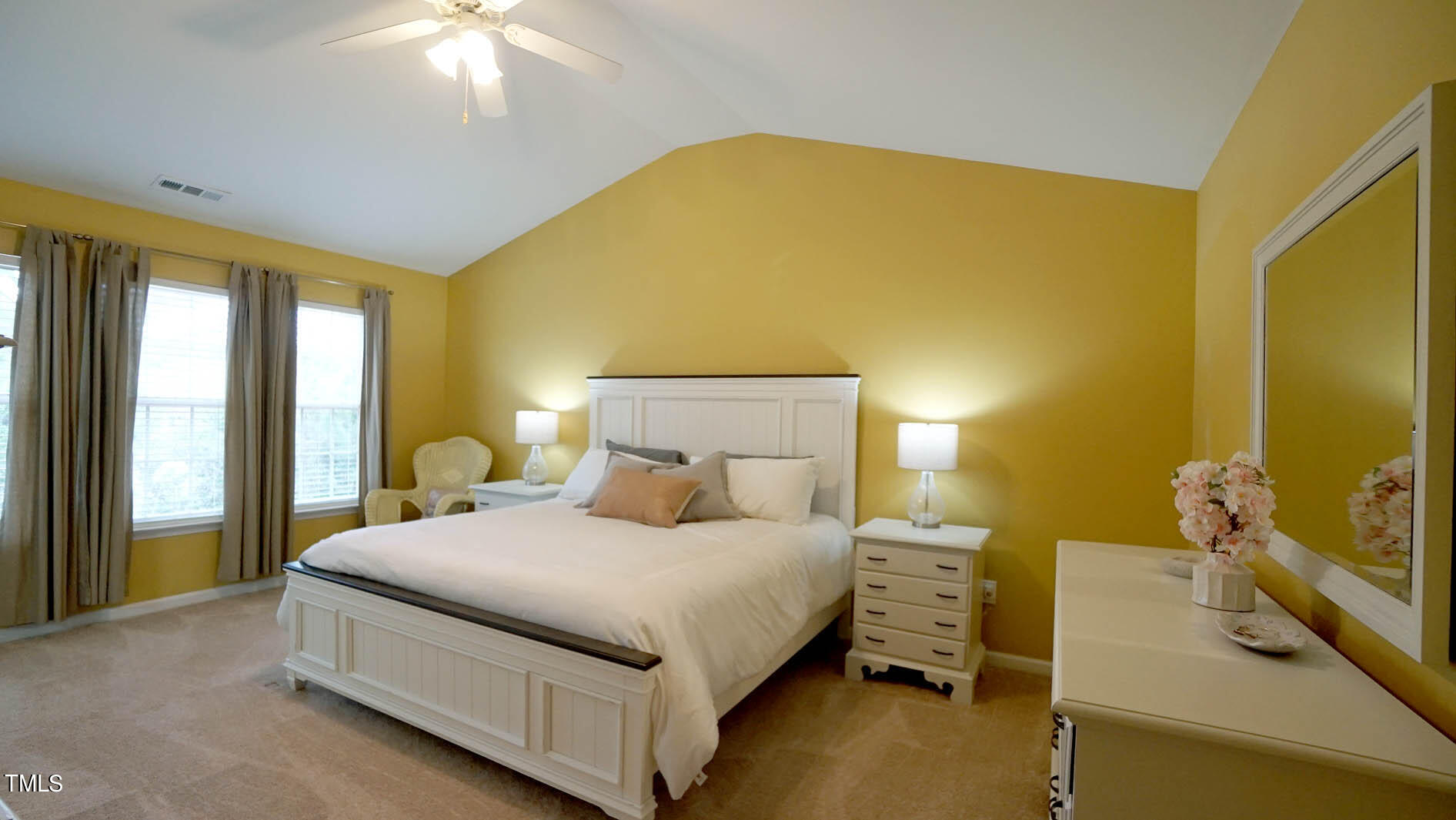 3318 Colorcott Street Raleigh, NC 27614 - Photo 22 of 28 a bedroom with a bed and a chandelier