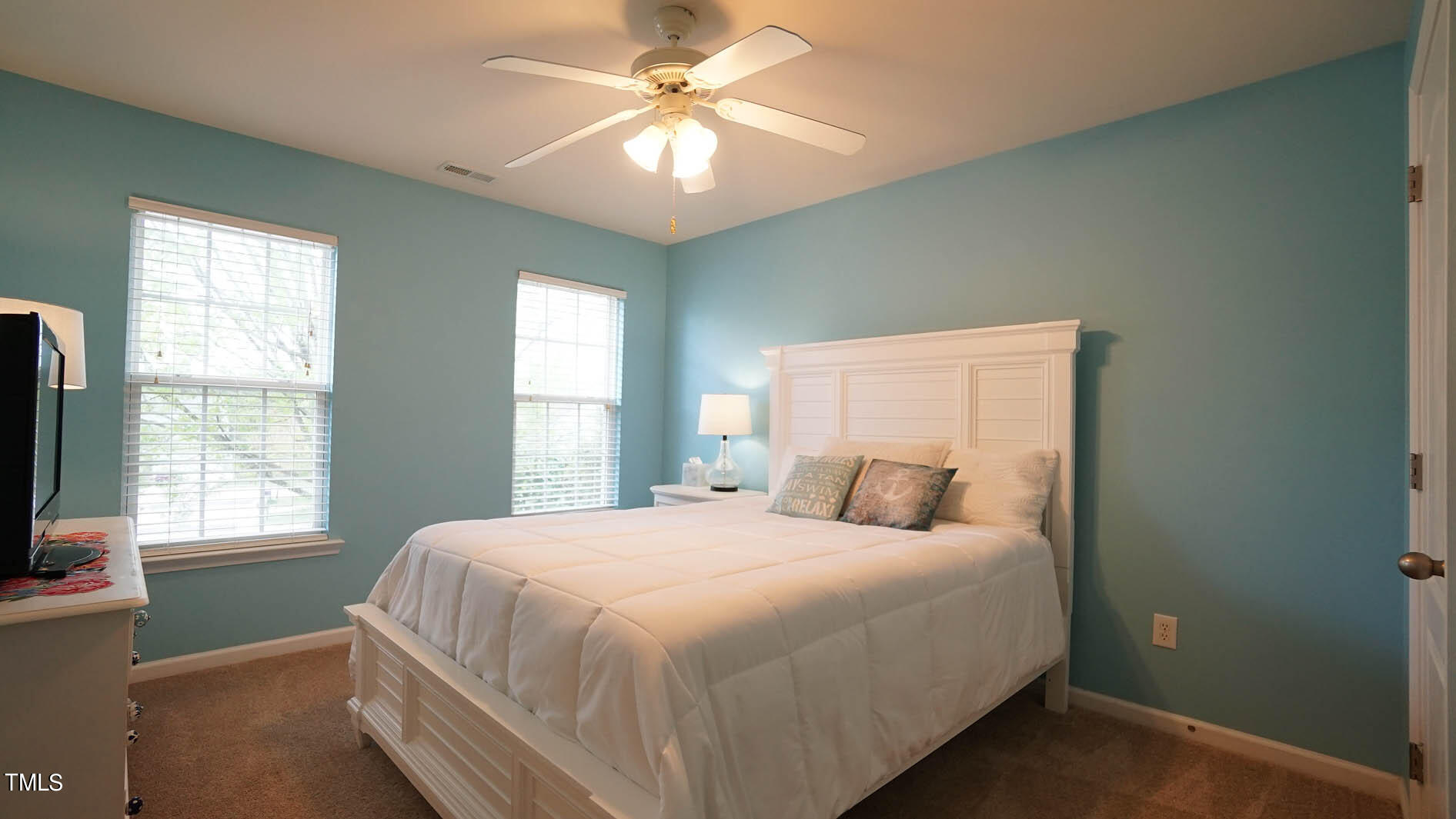 3318 Colorcott Street Raleigh, NC 27614 - Photo 27 of 28 a bedroom with a large bed and a window