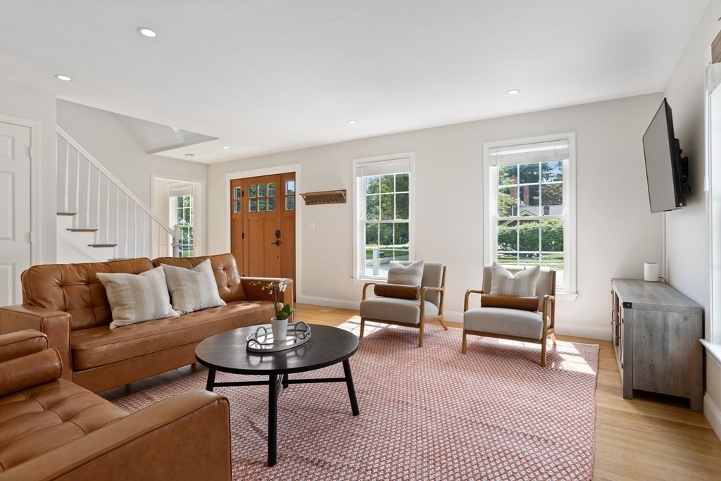 1 Sarah Lane Maynard, MA 01754 - Photo 14 of 40 a living room with furniture and a flat screen tv