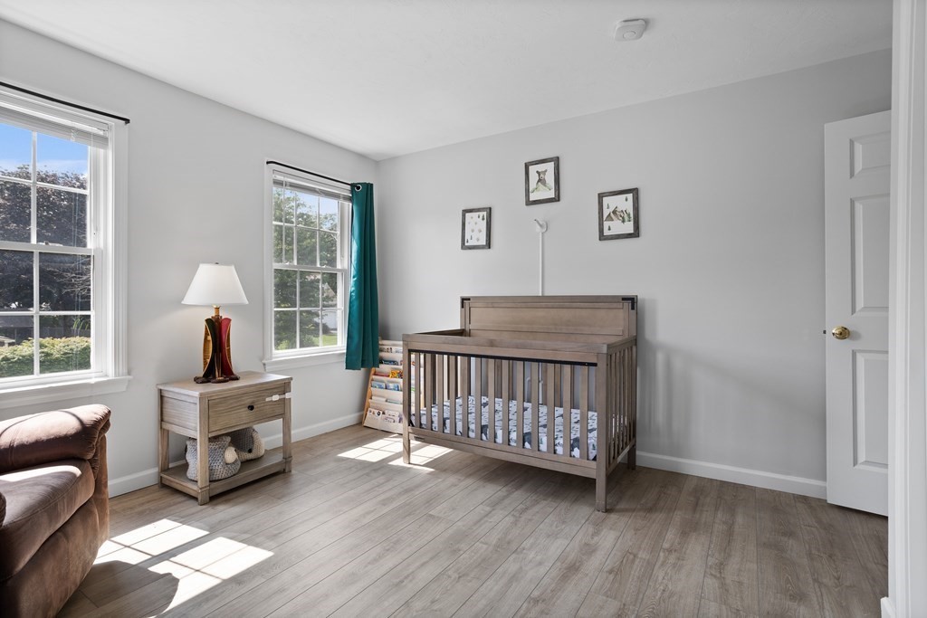 1 Sarah Lane Maynard, MA 01754 - Photo 20 of 40 a bedroom with furniture and a large window