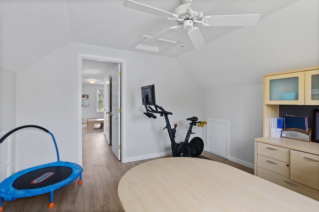 1 Sarah Lane Maynard, MA 01754 - Photo 29 of 40 a bedroom with a bed and a chandelier