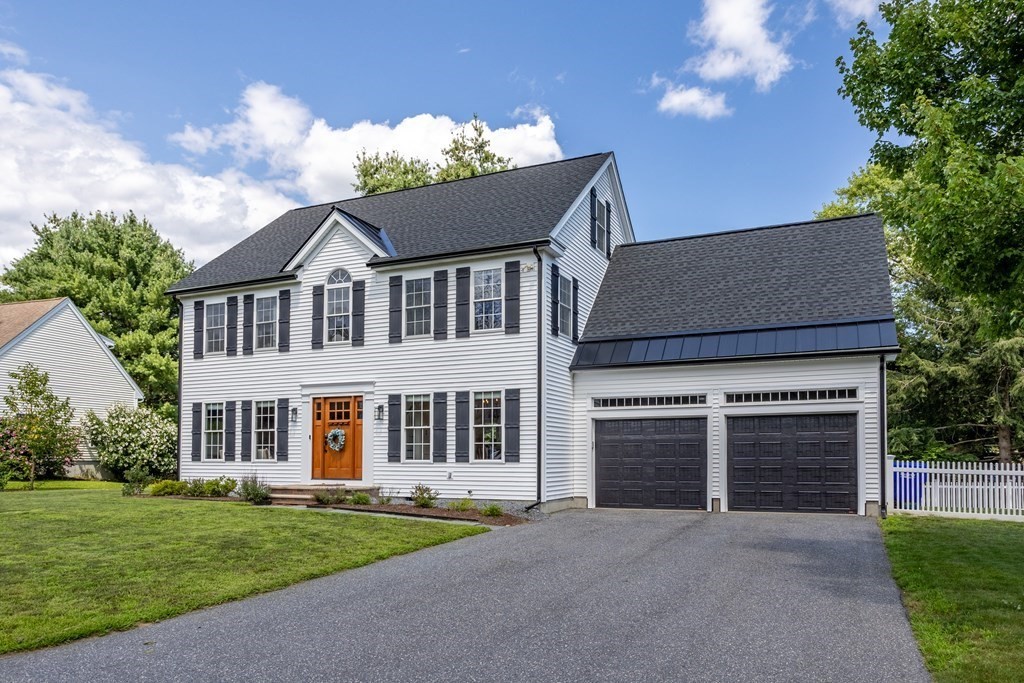1 Sarah Lane Maynard, MA 01754 - Photo 31 of 40 front view of a house with a yard