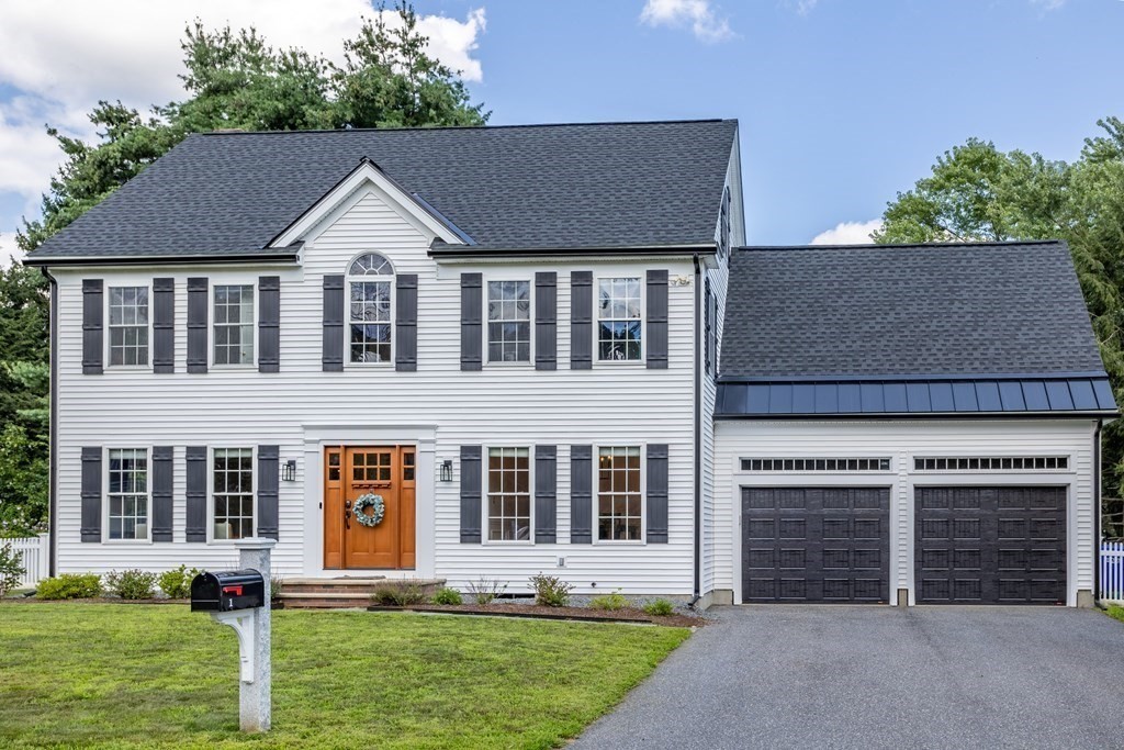 1 Sarah Lane Maynard, MA 01754 - Photo 32 of 40 front view of a house with a yard