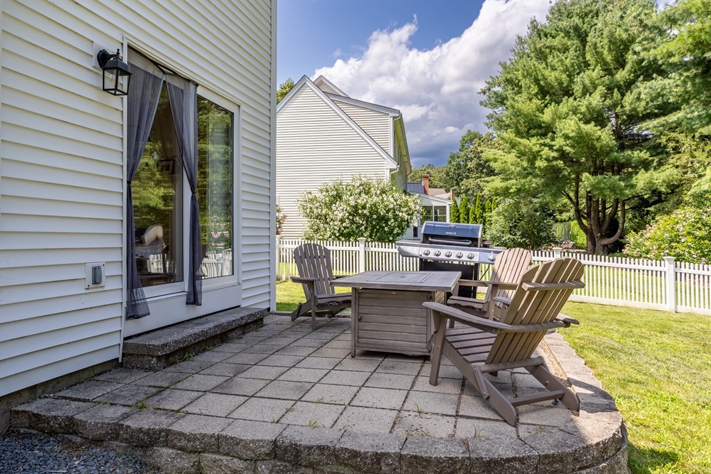1 Sarah Lane Maynard, MA 01754 - Photo 35 of 40 a view of a chairs and tables in the back yard of the house