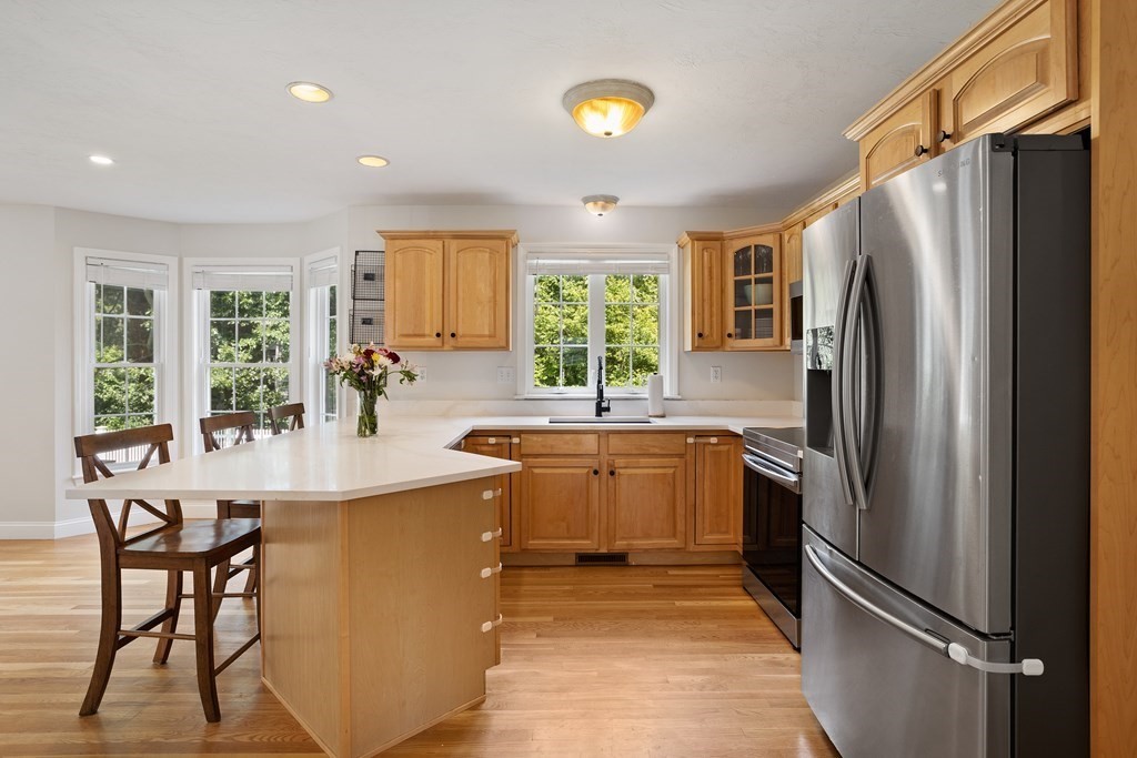 1 Sarah Lane Maynard, MA 01754 - Photo 5 of 40 a kitchen with stainless steel appliances granite countertop a refrigerator a stove a sink and a refrigerator