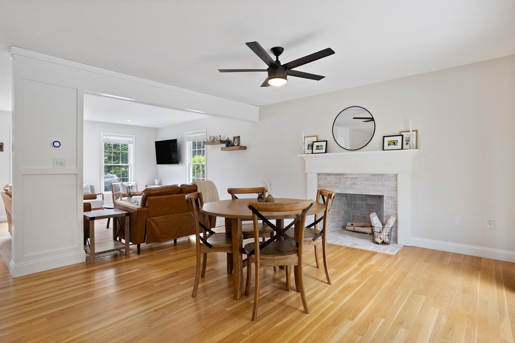 1 Sarah Lane Maynard, MA 01754 - Photo 10 of 40 a living room with furniture a fireplace and wooden floor