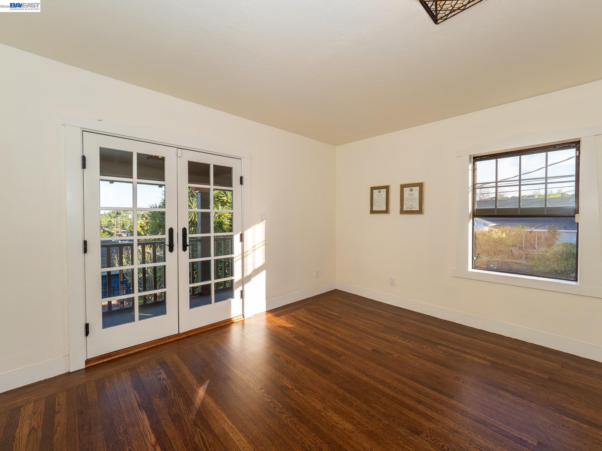 22111 Prospect Street Hayward, CA 94541 - Photo 21 of 70 a view of an empty room with wooden floor and a window