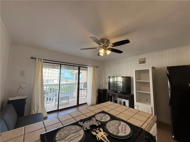 a bed room with a bed and a television