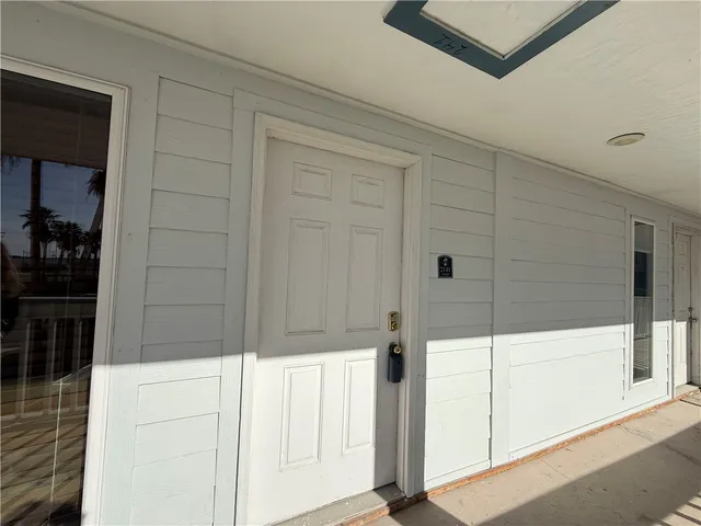 a bathroom with a glass door shower