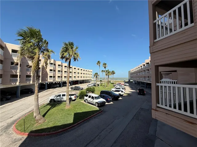 a view of a balcony with chairs