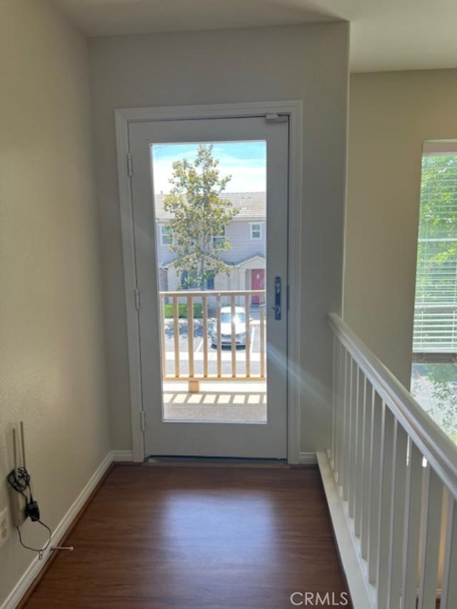 14566 Rochester Avenue Chino, CA 91710 - Photo 14 of 33 a view of an empty room with wooden floor and a window