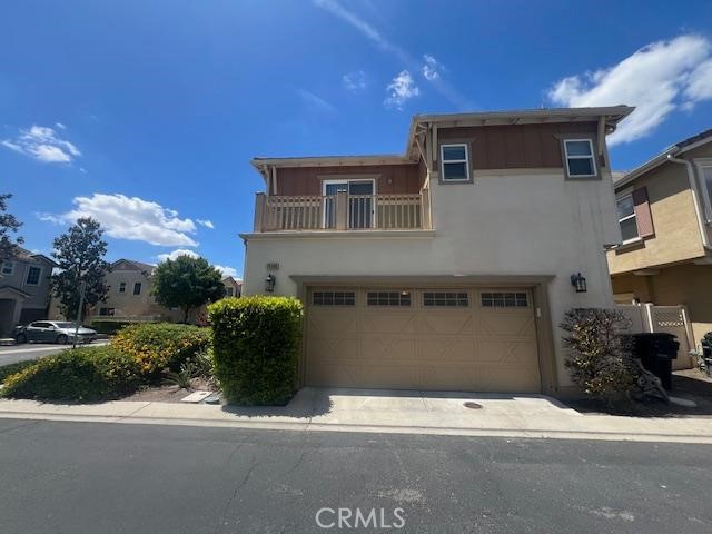 14566 Rochester Avenue Chino, CA 91710 - Photo 2 of 33 a front view of a house with a yard