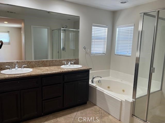 14566 Rochester Avenue Chino, CA 91710 - Photo 23 of 33 a bathroom with a tub sink and mirror