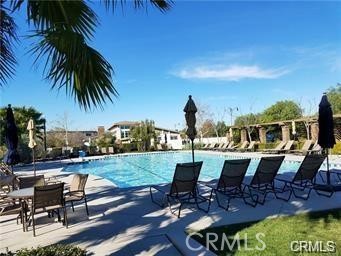 14566 Rochester Avenue Chino, CA 91710 - Photo 33 of 33 a view of a patio with table and chairs floor to ceiling window and wooden floor