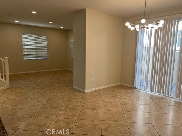 14566 Rochester Avenue Chino, CA 91710 - Photo 4 of 33 a view of a livingroom with a chandelier