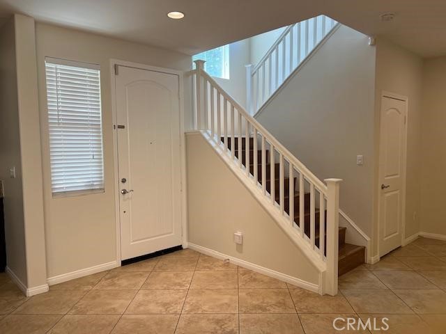 14566 Rochester Avenue Chino, CA 91710 - Photo 6 of 33 a view of a hallway with windows and stairs