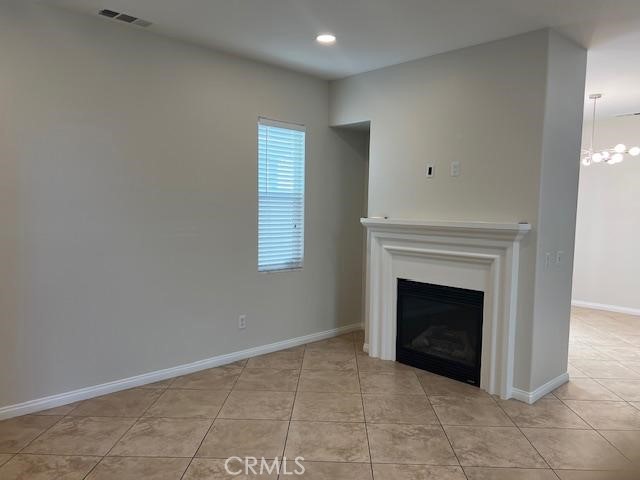14566 Rochester Avenue Chino, CA 91710 - Photo 7 of 33 a view of an empty room with a fireplace