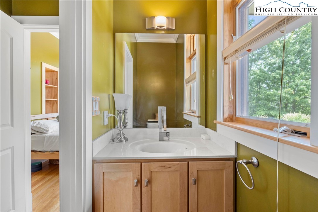 461 Summit Rise Drive Boone, NC 28607 - Photo 24 of 50 a bathroom with a sink and a mirror