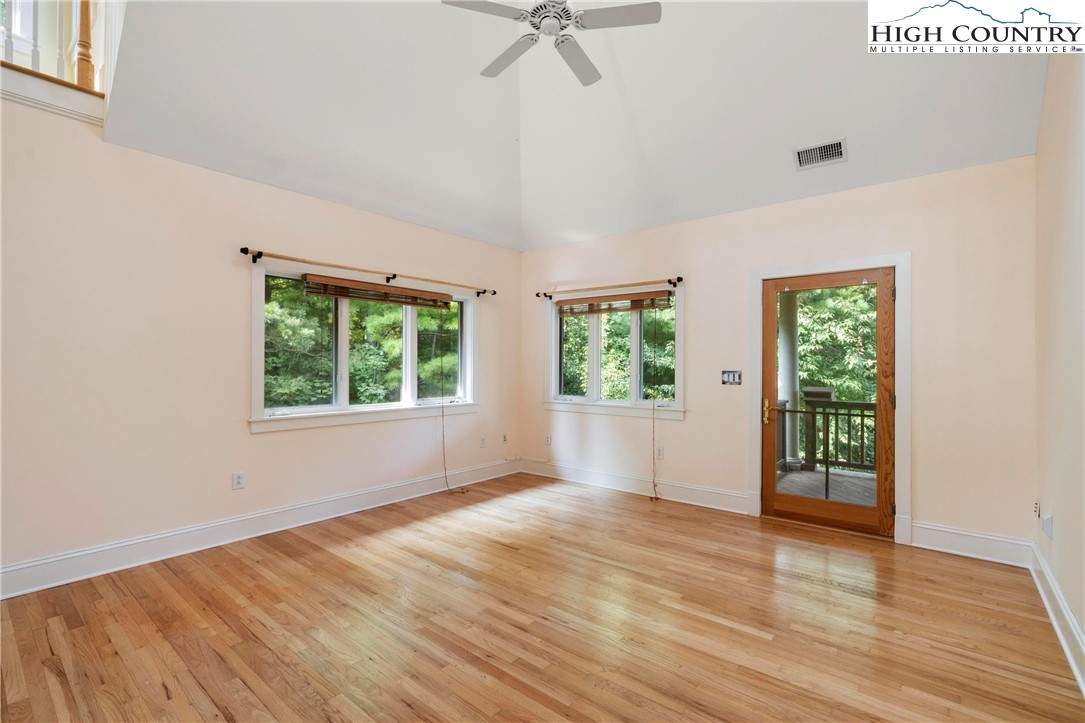 461 Summit Rise Drive Boone, NC 28607 - Photo 25 of 50 an empty room with wooden floor fan and windows