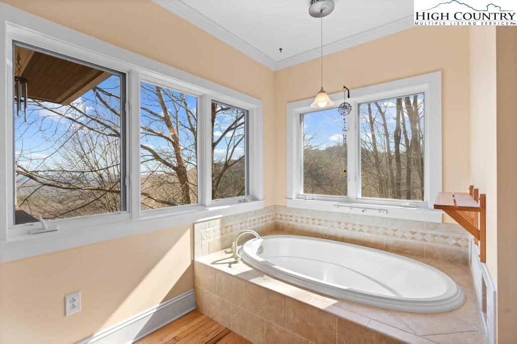 461 Summit Rise Drive Boone, NC 28607 - Photo 27 of 50 a bath tub sitting in front of a window
