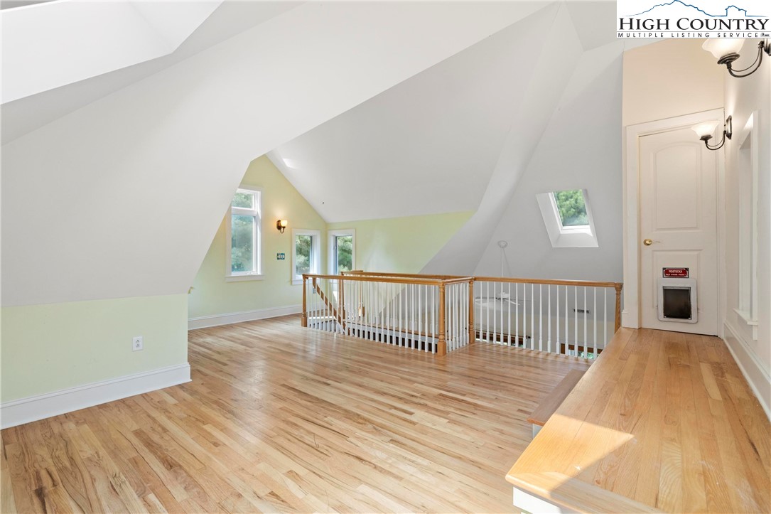 461 Summit Rise Drive Boone, NC 28607 - Photo 28 of 50 a view of a hallway with wooden floor and stairs