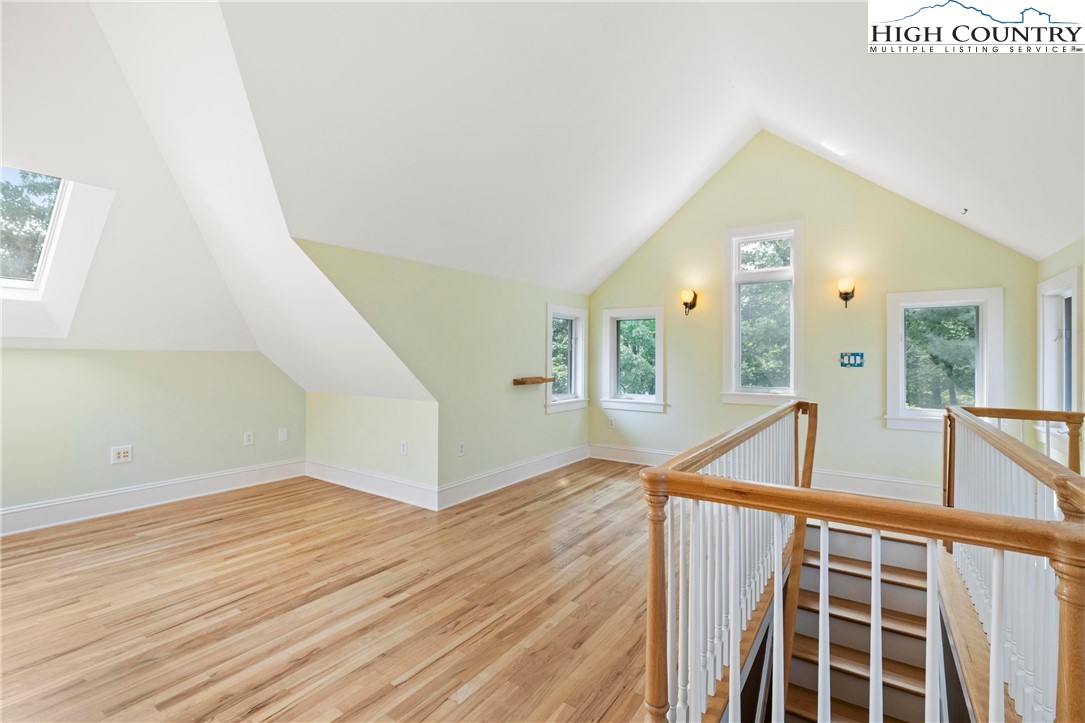 461 Summit Rise Drive Boone, NC 28607 - Photo 29 of 50 a view of a hallway with wooden floor and staircase