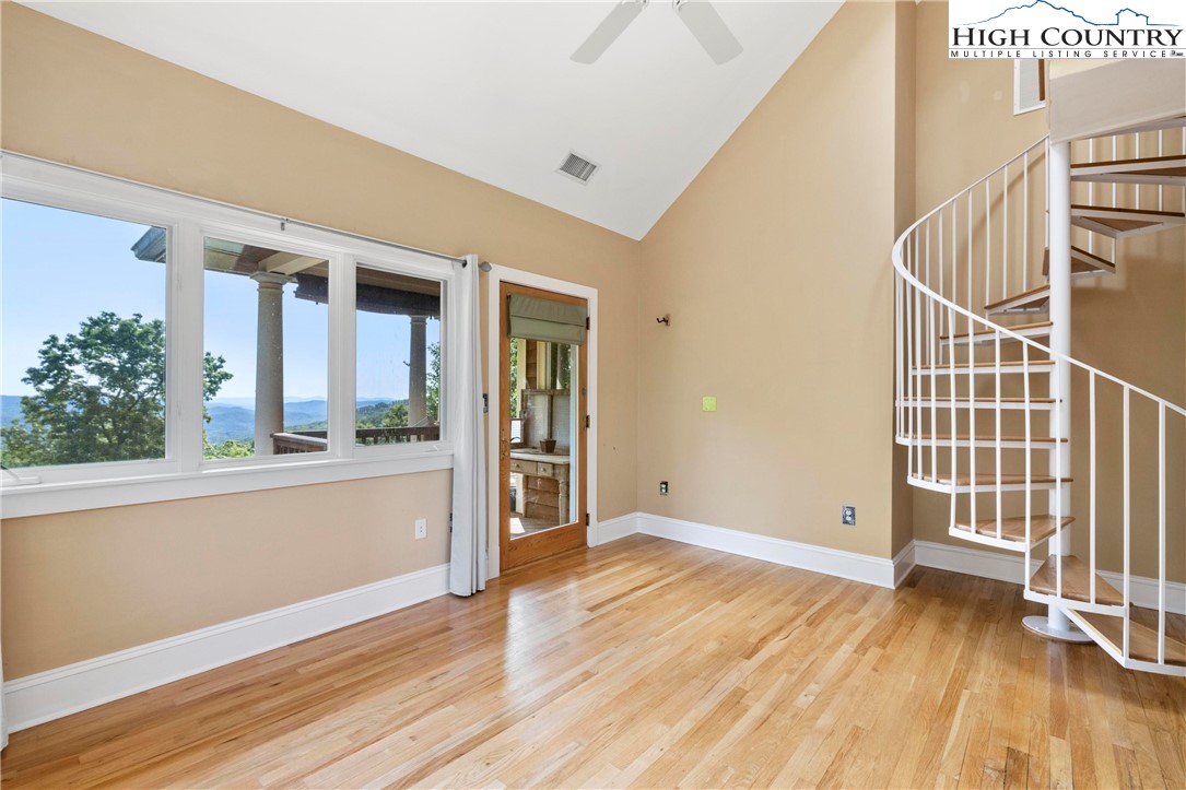 461 Summit Rise Drive Boone, NC 28607 - Photo 35 of 50 an empty room with wooden floor and windows